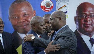 Felix Tshisekedi, right, of Congo&#39;s Union for Democracy and Social Progress opposition party, hugs Vital Kamerhe, left, of Congo&#39;s Union for the Congolese Nation opposition party, after being endorsed Kamerhe at a press conference in Nairobi, Kenya Friday, Nov. 23, 2018. Congo&#39;s two leading opposition parties announced Friday they are joining forces for a run at the presidency after withdrawing from a wider pact to support a single contender to take on President Joseph Kabila&#39;s chosen candidate. (AP Photo/Ben Curtis)