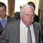 In this Oct. 7, 2008, photo, Jerome Corsi (right) arrives at the immigration department in Nairobi, Kenya. Corsi, a conservative writer and associate of President Donald Trump confidant Roger Stone says he is in plea talks with special counsel Robert Mueller’s team. Jerome Corsi told The Associated Press on Friday, Nov. 23, 2018, that he has been negotiating a potential plea but declined to comment further. (AP Photo) **FILE**