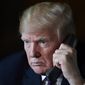 President Donald Trump talks with troops via teleconference from his Mar-a-Lago estate in Palm Beach, Fla., Thursday, Nov. 22, 2018. (AP Photo/Susan Walsh)