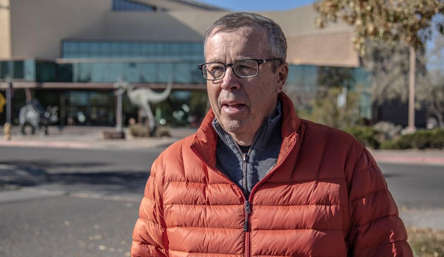 This image provided by the New Mexico Department of Cultural Affairs shows paleontology curator Spencer Lucas talking about Gordodon, a specialized plant-eating reptile, during an interview outside the New Mexico Museum of Natural History & Science in Albuquerque, N.M. Fossil bones were discovered near Alamogordo by Ethan Schuth while on a University of Oklahoma geology class field trip in 2013. The bones, part of an exquisitely preserved but incomplete skeleton, are on display at the museum. (New Mexico Department of Cultural Affairs via AP)