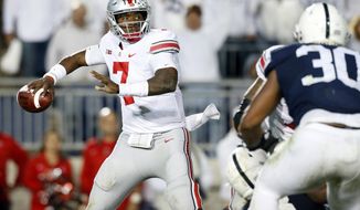 FILE - In this Saturday, Sept. 29, 2018 file photo, Ohio State quarterback Dwayne Haskins Jr. (7) throws a pass against Penn State during the second half of an NCAA college football game in State College, Pa. Last year’s Ohio State hero has to try to beat Michigan again in The Game. Backup quarterback Dwayne Haskins Jr. entered the game in the third quarter because an injury to starter J.T. Barrett. Haskins sparked a touchdown drive and an eventual 31-20 win over the Wolverines in Ann Arbor. Now the starter, Haskins will lead the No. 10 Buckeyes against No. 4 Michigan on Saturday at Ohio Stadium. Ohio State enters the game in an unfamiliar position _ underdog. (AP Photo/Chris Knight, File)