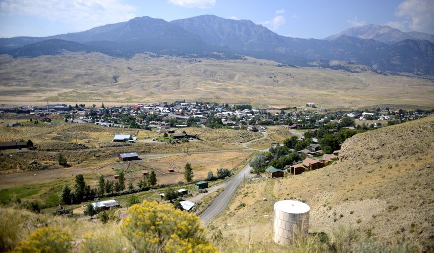 This Aug. 17, 2017 photo shows a view of Gardiner, Mont., the gateway town to Yellowstone National Park. Gardiner is struggling with housing affordability as home prices rise and owners turn rental properties into vacation rentals. The shift is contributing to a loss of students in the school district. (Rachel Leathe/Bozeman Daily Chronicle via AP)