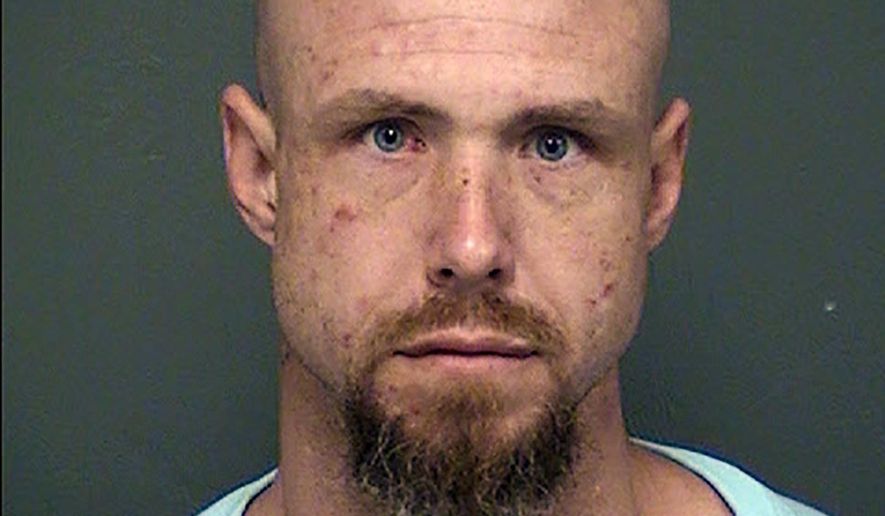 This undated booking photo released by the Tucson Police Department shows arrested man David James Bohart. Tucson police say Bohart was released from the Tucson state prison complex Monday, Nov. 19, 2018, and is accused of killing a woman the same day. Police say Bohart was arrested at a hotel Friday, Nov. 23, on suspicion of second-degree murder in the killing of 49-year-old Marika L. Jones at a Tucson home. Bohart remained jailed Saturday and online court records don't list an attorney who could comment on his behalf. (Tucson Police Department via AP)