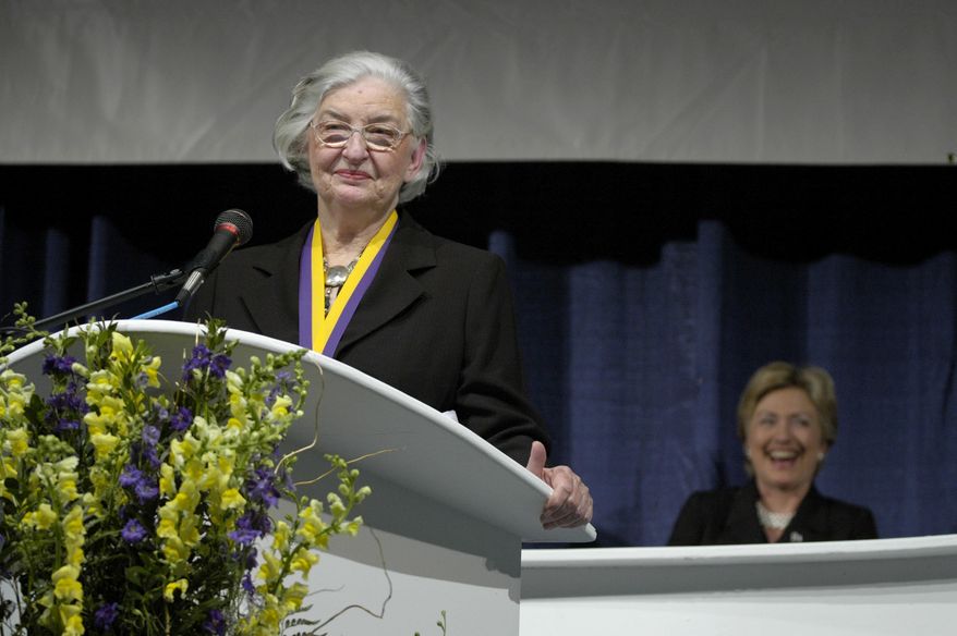 FILE - In this Oct. 8, 2005 file photo, Betty Bumpers speaks after being inducted into the National Women's Hall of Fame in Seneca Falls, N.Y. Fellow-inductee Hillary Clinton is pictured to the right. Bumpers, the wife of former Arkansas governor and four-term U.S. Sen. Dale Bumpers has died at her home in Little Rock. The daughter of Bumpers, Brooke Bumpers, said her mother died Friday, Nov. 23, 2018, of complications from a recent fall and dementia. She was 93. (AP Photo/Kevin Rivoli, File)