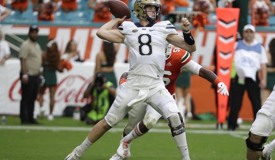 Pittsburgh quarterback Kenny Pickett passes (8) during the first half of an NCAA college football game against Miami, Saturday, Nov. 24, 2018, in Miami Gardens, Fla. (AP Photo/Lynne Sladky)