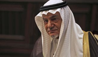 Saudi Prince Turki al-Faisal talks to the Associated Press in Abu Dhabi, United Arab Emirates, Saturday Nov. 24, 2018. A prominent Saudi royal says whether or not heads of state gathered in Argentina next week for the Group of 20 summit warmly engage with Crown Prince Mohammed bin Salman, he is someone &amp;quot;that they have to deal with.&amp;quot;  Prince Turki al-Faisal told The Associated Press the kingdom &amp;quot;will have to bear&amp;quot; that its reputation has been tarred by the killing of Saudi writer Jamal Khashoggi in its Istanbul consulate last month.  (AP Photo/Kamran Jebreili)