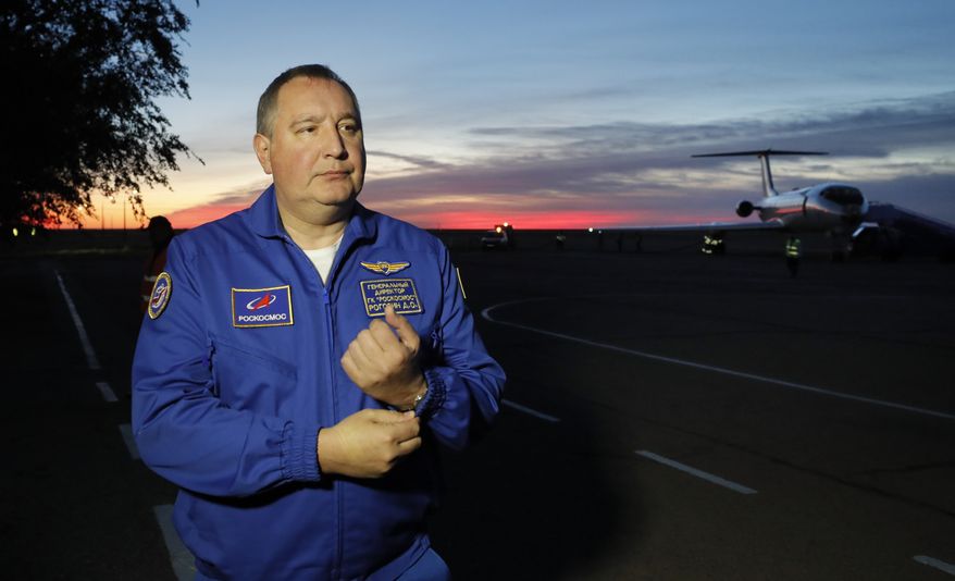 Director General of the Russia state corporation Roscosmos Dmitry Rogozin walks in Baikonur airport after a rescue operation for NASA astronaut Nick Hague and Russian cosmonaut Alexey Ovchinin after an emergency landing, in Kazakhstan, Thursday, Oct. 11, 2018. (Yuri Kochetkov/Pool Photo via AP)