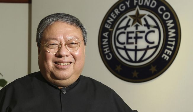 FILE - In this July 2015, file photo, Dr. Chi Ping Patrick Ho, former Hong Kong home secretary, deputy chairman of an non-governmental organization funded by CEFC China Energy poses during an interview in Hong Kong. Jury selection starts Monday, Nov. 26, 2018, in New York for the prominent Hong Kong businessman&#x27;s bribery trial. Ho was arrested in 2017 on charges he paid bribes so a Chinese energy conglomerate could secure business advantages. (AP Photo/File)