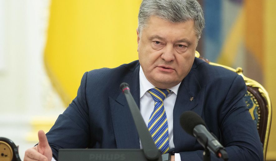 Ukrainian President Petro Poroshenko leads the National Security and Defence Council meeting in Kiev, Ukraine, Sunday, Nov. 25, 2018. Russia&#x27;s coast guard opened fire on and seized three of Ukraine&#x27;s vessels Sunday, wounding two crew members, after a tense standoff in the Black Sea near the Crimean Peninsula, the Ukrainian navy said. (Mykhailo Markiv, Presidential Press Service via AP, Pool)