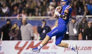 Boise State tight end John Bates secures a long pass into the red zone during the team&#x27;s NCAA college football game against Utah State on Saturday, Nov. 24, 2018, in Boise, Idaho. (Darin Oswald/Idaho Statesman via AP)