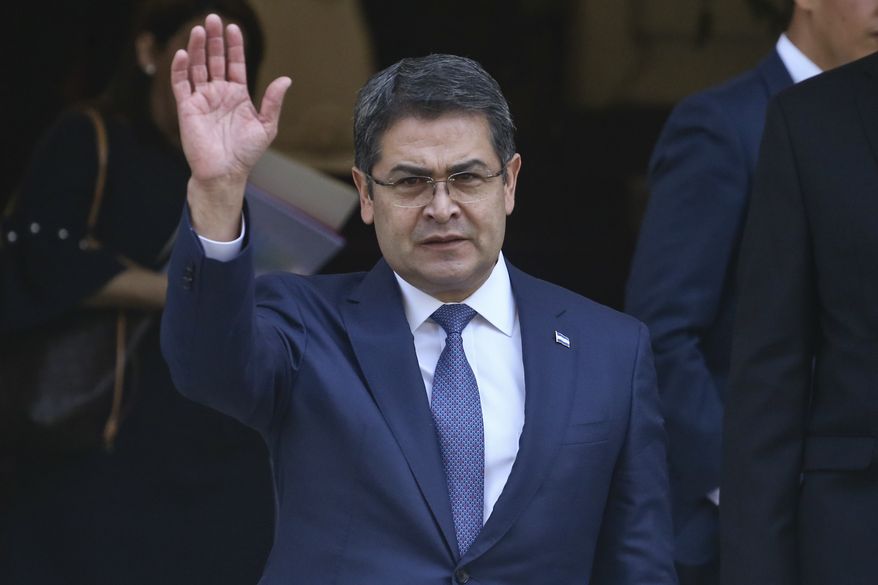 President of Honduras Juan Orlando Hernandez waves as he exitsthe Academia Diplomatica de Chile where he met with President-elect Sebastian Pinera, in Santiago, Saturday, March 10, 2018.  Hernandez is in Chile to attend Sunday&#39;s presidential inauguration ceremony for Pinera, who led Chile from 2010-2014. (AP Photo/Esteban Felix)