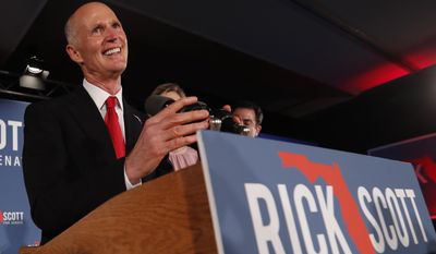 Republican Senate candidate Rick Scott smiles as he speaks to supporters at an election watch party, Wednesday, Nov. 7, 2018, in Naples, Fla. (AP Photo/Wilfredo Lee)