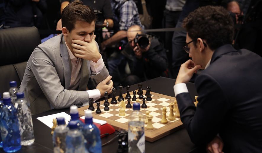 Carlsen presses but held to draw in world chess championship match's first  game - Washington Times