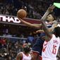 Washington Wizards guard Bradley Beal, center, goes to the basket against Houston Rockets center Clint Capela (15) and guard James Harden, lower left, during the second half of an NBA basketball game, Monday, Nov. 26, 2018, in Washington. (AP Photo/Nick Wass) ** FILE **