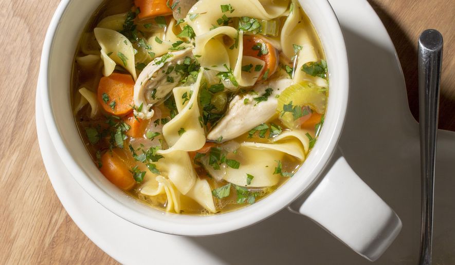 This undated photo provided by America's Test Kitchen in November 2018 shows classic chicken noodle soup. (Carl Tremblay/America's Test Kitchen via AP)