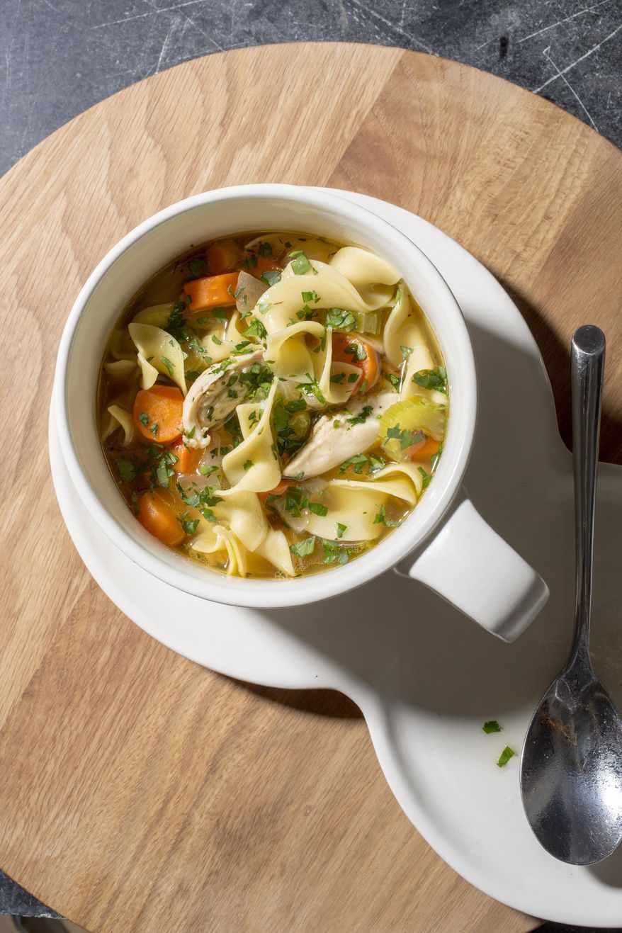 This undated photo provided by America's Test Kitchen in November 2018 shows classic chicken noodle soup. (Carl Tremblay/America's Test Kitchen via AP)