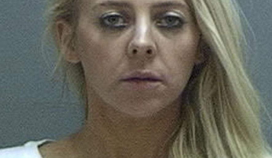 This undated photo provided by the Salt Lake County Sheriff&#x27;s Office shows Chelsea Watrous Cook. Police say Cook, a Utah high school teacher, shot and killed her ex-husband&#x27;s girlfriend while the former couple&#x27;s children looked on.  (Salt Lake County Sheriff&#x27;s Office via AP)