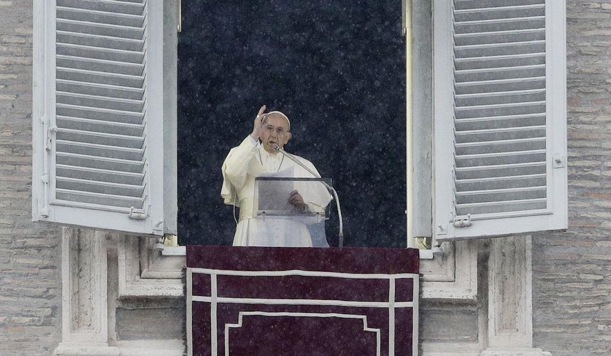 Pope Francis delivers a blessing from his studio window overlooking St.Peter's Square on the occasion of the Angelus noon prayer, at the Vatican, Sunday, Nov. 25, 2018. (AP Photo/Gregorio Borgia)