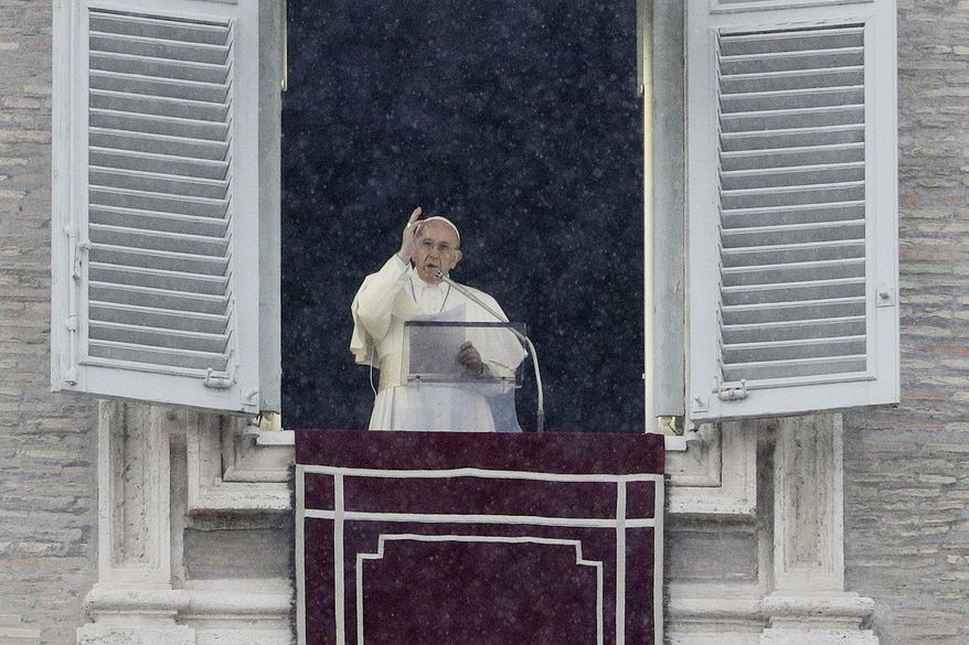 Pope Francis delivers a blessing from his studio window overlooking St.Peter's Square on the occasion of the Angelus noon prayer, at the Vatican, Sunday, Nov. 25, 2018. (AP Photo/Gregorio Borgia)