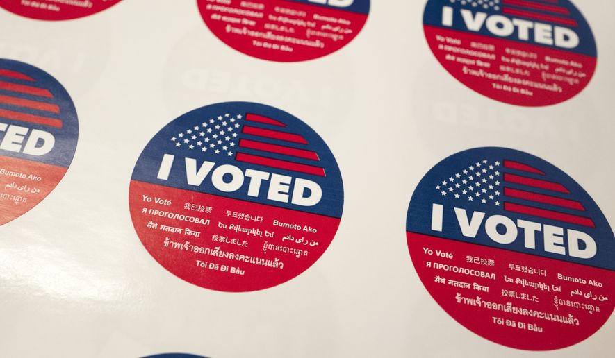 "I Voted" stickers wait for voters at a polling station inside the library at Robert F. Kennedy Elementary School in Los Angeles on Tuesday, June 5, 2018. Traffic at polling stations was expected to be light because people voted in advance. (AP Photo/Richard Vogel)