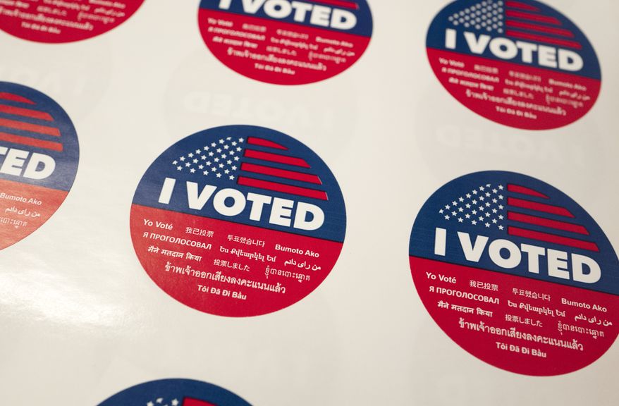 "I Voted" stickers wait for voters at a polling station inside the library at Robert F. Kennedy Elementary School in Los Angeles on Tuesday, June 5, 2018. Traffic at polling stations was expected to be light because people voted in advance. (AP Photo/Richard Vogel)