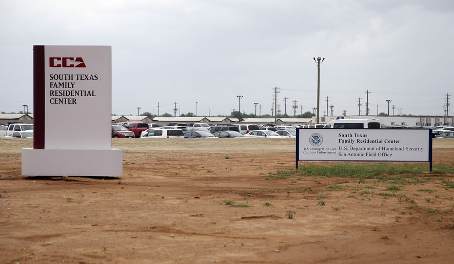 FILE - In this June 30, 2015, file photo, signs are seen at the entrance to the South Texas Family Residential Center in Dilley, Texas. Lawyers for the mother of a toddler who died several weeks after being released from the nation's largest family detention center have filed a legal claim seeking $60 million from the U.S. government for the child's death. Attorneys for Yazmin Juarez submitted the claim Tuesday, Nov. 27, 2018. (AP Photo/Eric Gay, File)