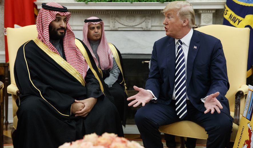 FILE - In this March 20, 2018, file photo, President Donald Trump meets with Saudi Crown Prince Mohammed bin Salman in the Oval Office of the White House in Washington. The prince and Trump are attending the upcoming Group of 20 summit in Argentina. (AP Photo/Evan Vucci, File)