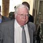 In this Oct. 7, 2008, file photo, Jerome Corsi, right, arrives at the immigration department in Nairobi, Kenya. (AP Photo, File)
