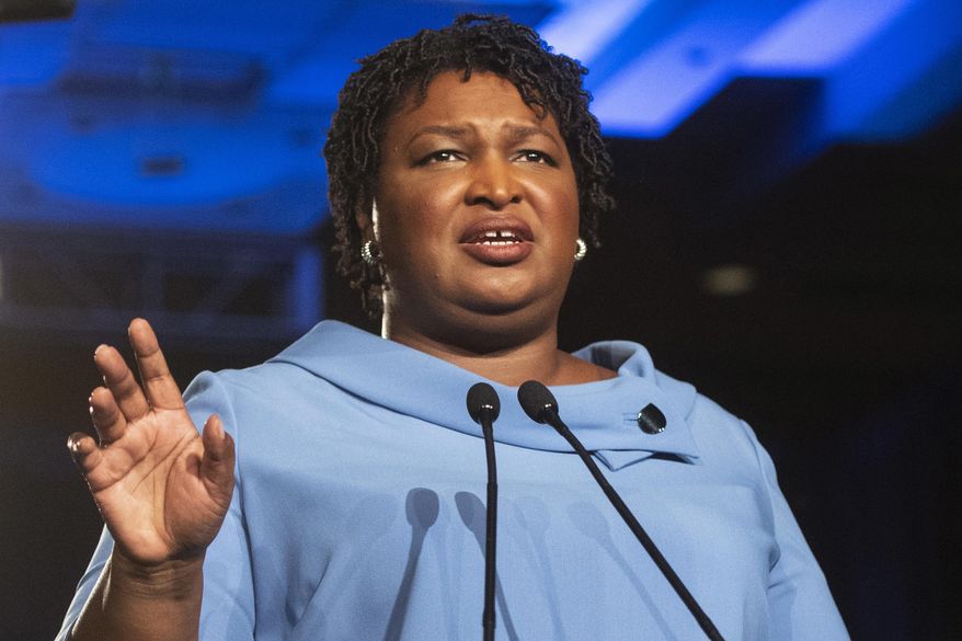 FILE - In this Nov. 6, 2018 file photo, Georgia Democratic gubernatorial candidate Stacey Abrams addresses supporters during an election night watch party in Atlanta. After losing governor’s races in Georgia and Florida, Stacey Abrams and Andrew Gillum are joining other black leaders to oppose one of President Donald Trump’s picks for a lifetime federal judgeship. Abrams and Gillum say the Senate must reject Thomas Farr’s nomination to a North Carolina district court. The Democrats say Farr is a threat to voting rights of nonwhites. Farr defended North Carolina laws that federal courts have found discriminatory against black voters. (AP Photo/John Amis)