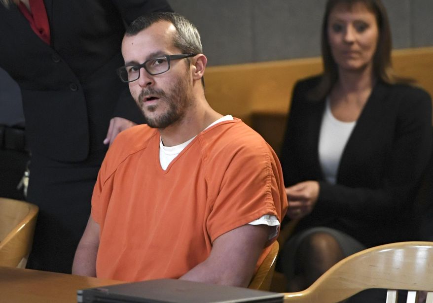 FILE - In this Nov. 19, 2018 file photo, Christopher Watts sits in court for his sentencing hearing at the Weld County Courthouse in Greeley, Colo. The family of a Colorado woman murdered by her husband has filed a wrongful death lawsuit, seeking financial damages. Christopher Watts pleaded guilty this month to killing his pregnant wife and their two young daughters and was sentenced to life in prison. (RJ Sangosti/The Denver Post via AP, Pool, File)