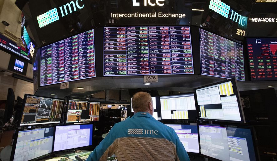 FILE- In this Nov. 20, 2018, file photo, a trader works at the New York Stock Exchange. The U.S. stock market opens at 9:30 a.m. EST on Tuesday, Nov. 27. (AP Photo/Mark Lennihan, File)