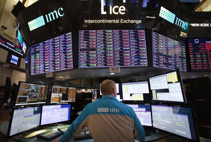 FILE- In this Nov. 20, 2018, file photo, a trader works at the New York Stock Exchange. The U.S. stock market opens at 9:30 a.m. EST on Tuesday, Nov. 27. (AP Photo/Mark Lennihan, File)