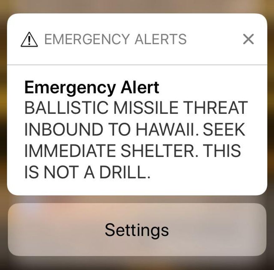 FILE - This Jan. 13, 2018 file smartphone screen capture shows a false incoming ballistic missile emergency alert sent from the Hawaii Emergency Management Agency system. A man who suffered a heart attack shortly after Hawaii mistakenly issued an alert about a ballistic missile is suing the state. The lawsuit filed in state court Tuesday, Nov. 27, 2018, said the sending of the false missile alert and failing to cancel it in a timely manner was a substantial factor in causing James Sean Shields' heart attack on Jan. 13. (AP Photo/Caleb Jones, File)