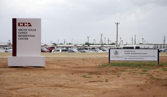 FILE - In this June 30, 2015, file photo, signs are seen at the entrance to the South Texas Family Residential Center in Dilley, Texas. Lawyers for the mother of a toddler who died several weeks after being released from the nation&#39;s largest family detention center have filed a legal claim seeking $60 million from the U.S. government for the child&#39;s death. Attorneys for Yazmin Juarez submitted the claim Tuesday, Nov. 27, 2018. (AP Photo/Eric Gay, File)