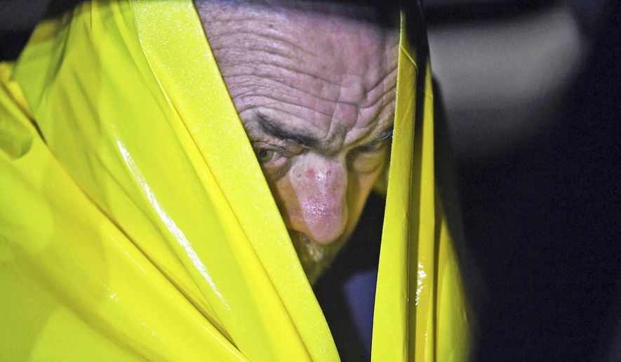 David Green, 72, of Swiftwater, Pa., sits in the back of an unmarked police vehicle on Tuesday, Nov. 27, 2018, in Mountainhome, Pa. Green, who may have been having trouble getting permits for work on his property, shot and killed a township employee in a government building Tuesday, then paced the hallway with his head in his hands until police arrived to take him into custody, authorities said. (Butch Comegys/The Times-Tribune via AP)