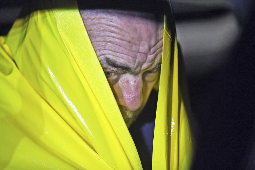 David Green, 72, of Swiftwater, Pa., sits in the back of an unmarked police vehicle on Tuesday, Nov. 27, 2018, in Mountainhome, Pa. Green, who may have been having trouble getting permits for work on his property, shot and killed a township employee in a government building Tuesday, then paced the hallway with his head in his hands until police arrived to take him into custody, authorities said. (Butch Comegys/The Times-Tribune via AP)