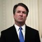 In this Oct. 8, 2018, file photo, Supreme Court Justice Brett Kavanaugh stands before a ceremonial swearing-in in the East Room of the White House in Washington. (AP Photo/Susan Walsh) ** FILE **