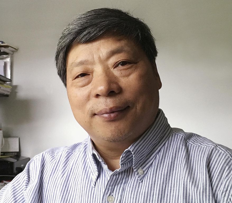 In this photo taken on July 2018 and released by Xu Xiaoli on Wednesday, Nov. 28, 2018, Lu Guang poses for a photo in New York. The wife of award-winning Chinese photographer Lu says he was taken away by state security agents more than three weeks ago during a trip to the country's far west. Lu's wife, Xu, says he was traveling in Xinjiang when she lost contact with him. (Xu Xiaoli via AP)