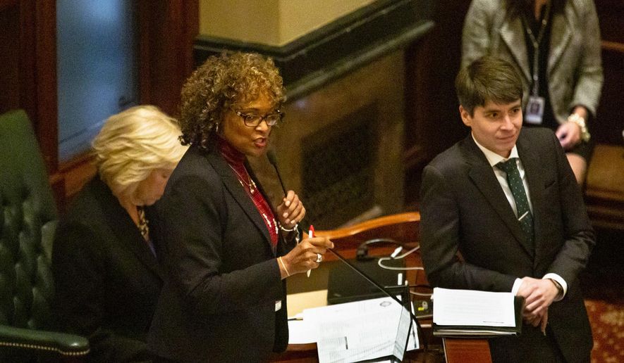 Rep. Camille Lilly, D-Oak Park, urges House members to override Gov. Bruce Rauner's veto of Tobacco 21, Wednesday, Nov. 28, 2018, at the Capitol in Springfield, Ill. The bill would have raised the age to 21 to buy tobacco products in the state, but the measure failed to pass in a floor vote. (Rich Saal/The State Journal-Register via AP)