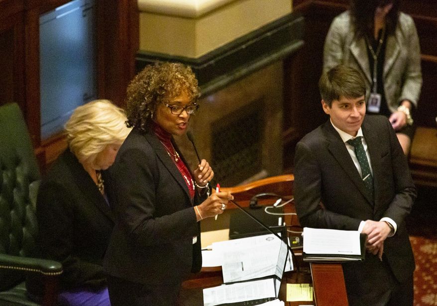 Rep. Camille Lilly, D-Oak Park, urges House members to override Gov. Bruce Rauner's veto of Tobacco 21, Wednesday, Nov. 28, 2018, at the Capitol in Springfield, Ill. The bill would have raised the age to 21 to buy tobacco products in the state, but the measure failed to pass in a floor vote. (Rich Saal/The State Journal-Register via AP)