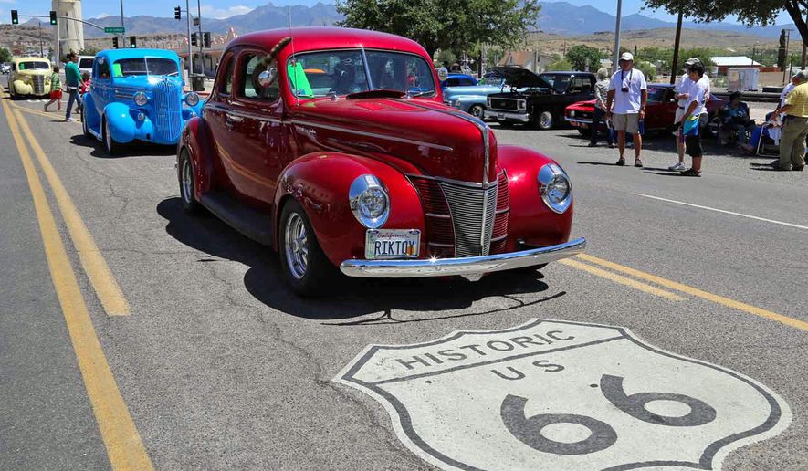 FILE - This 2017 file photo shows the annual Route 66 Fun Run, featuring vintage autos from all eras, on a street in Kingman, Ariz. A new U.S. Senate proposal would designate Route 66, the Mother Road that connected Chicago to Los Angeles and was once an economic driver for small towns across the post-World War II nation, as a National Historic Trail. (Kingman Daily Miner via AP,File)