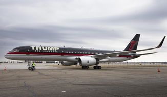 FILE - In this March 1, 2016 file photo, Republican presidential candidate Donald Trump&#x27;s private jet arrives at Port-Columbus International Airport, in Columbus, Ohio. President Donald Trump&#x27;s private jet, an instantly recognizable Boeing 757 used during his campaign, was caught up in a quintessential New York City traffic mishap at LaGuardia Airport on Wednesday, Nov. 28, 2018: a fender bender while someone else was trying to park. A corporate jet maneuvering into a parking spot clipped the wing of Trump&#x27;s parked plane around 8:30 a.m., Trump&#x27;s company, The Trump Organization, confirmed. (AP Photo/John Minchillo, File)