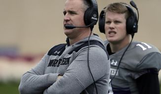 FILE - In this Oct. 27, 2018, file photo, Northwestern head coach Pat Fitzgerald, left, watches his team during the second half of an NCAA college football game against Wisconsin in Evanston, Ill. The program’s winningest coach by a wide margin, Fitzgerald has No. 21 Northwestern playing in the Big Ten championship game for the first time. (AP Photo/Nam Y. Huh, File)
