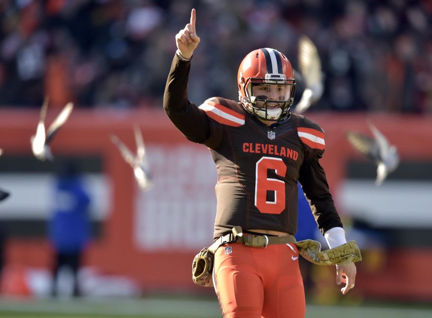 FILE -In this Sunday, Nov. 11, 2018, file photo, Cleveland Browns quarterback Baker Mayfield (6) celebrates a touchdown in the second quarter of a 28-16 win over the Atlanta Falcons in an NFL football game in Cleveland. Mayfield had a November to remember, completing 74 percent of his passes while leading the Browns (4-6-1) to two wins and the edge of playoff possibilities. (AP Photo/David Richard, File)