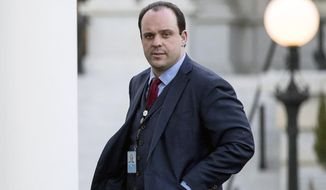 In this March 8, 2017, file photo, Boris Epshteyn, then special assistant to President Donald Trump, walks into the West Wing of the White House in Washington. The Sinclair Broadcast Group is distancing itself from commentary by Epshteyn, its chief political analyst, who this week supported the Trump administration&#39;s efforts to stop migrants at the U.S. border with Mexico. The commentary has triggered protests, and the National Association of Hispanic Journalists said it is reconsidering allowing Sinclair representatives to attend its job recruitment events. (AP Photo/Andrew Harnik, File)