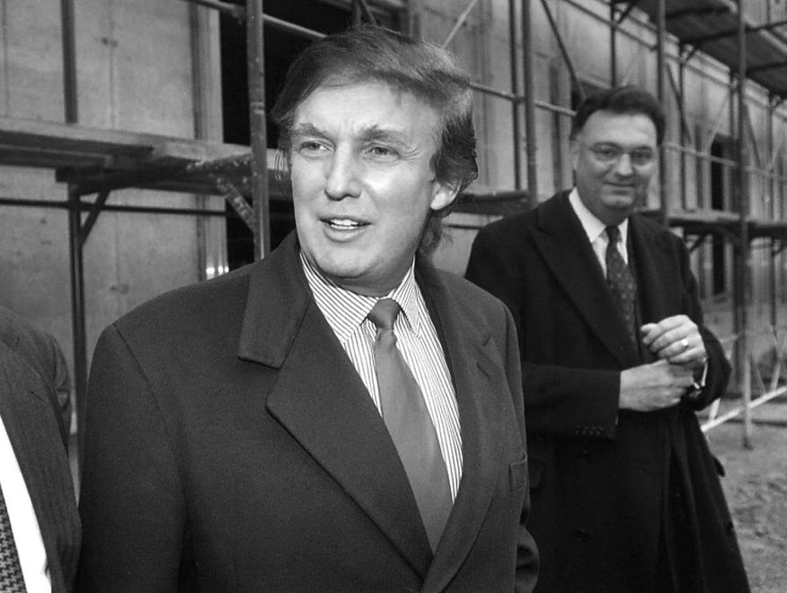 FILE - In this Nov. 5, 1996 file photo, American real estate mogul Donald Trump, left, checks out sites in Moscow, Russia, for luxury residential towers. Trump&#39;s decades-long dream of building a luxury tower in the heart of Moscow flared and fizzled several times over the years, most recently when his presidential campaign was gaining momentum. That latest plan led his former lawyer Michael Cohen to plead guilty to a charge of lying to congressional investigators about key details in the negotiations, most notably that those talks stretched far deeper into the 2016 campaign than previously thought. (AP Photo/Igor Tabakov, File)
