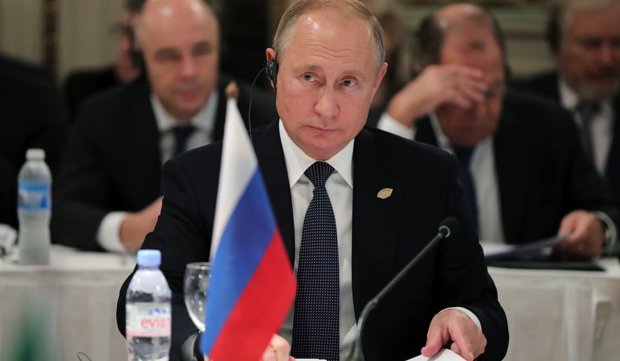 Russian President Vladimir Putin attends the G-20 summit in Buenos Aires, Argentina, Friday, Nov. 30, 2018. Leaders from the Group of 20 industrialized nations are meeting in Buenos Aires for two days starting today. (Mikhail Klimentyev, Sputnik, Kremlin Pool Photo via AP)
