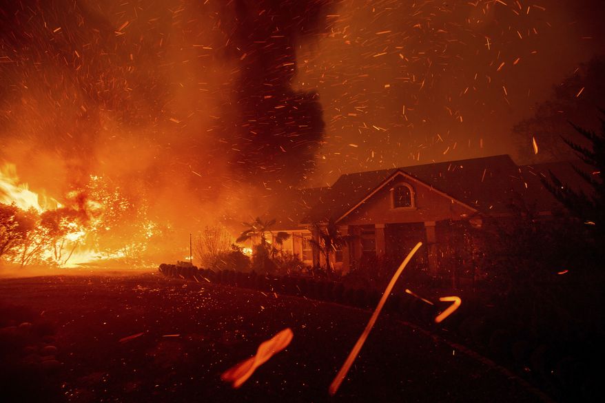n this Thursday, Nov. 8, 2018, photo, the Camp Fire rages through Paradise, Calif. U.S. Interior Secretary Ryan Zinke says wildfires in California in 2018, released roughly the same amount of carbon emissions as are produced each year to provide electricity to the state. (AP Photo/Noah Berger) **FILE**