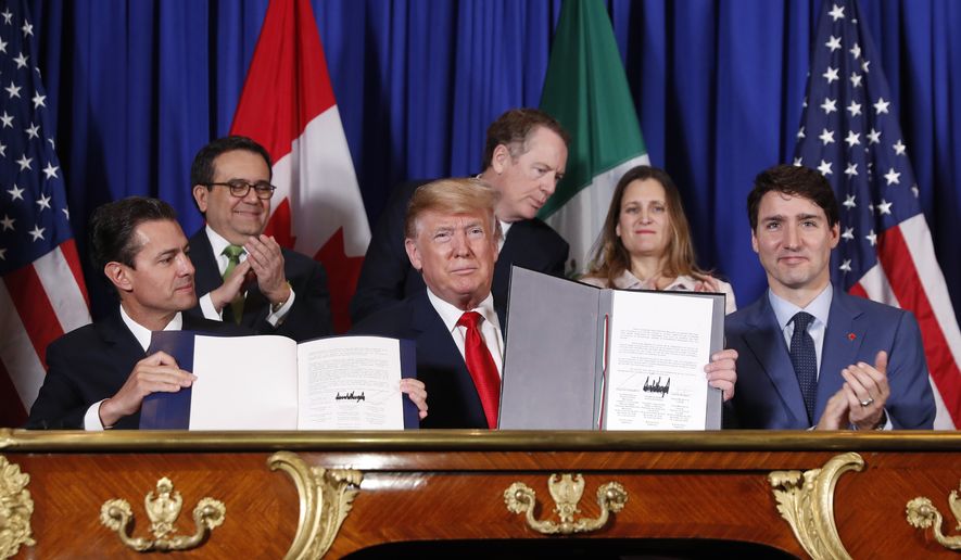 President Donald Trump, Canada&#x27;s Prime Minister Justin Trudeau, right,  and Mexico&#x27;s President Enrique Pena Neto, left, participate in the USMCA signing ceremony, Friday, Nov. 30, 2018 in Buenos Aires, Argentina, in this file photo. (AP Photo/Pablo Martinez Monsivais) **FILE**