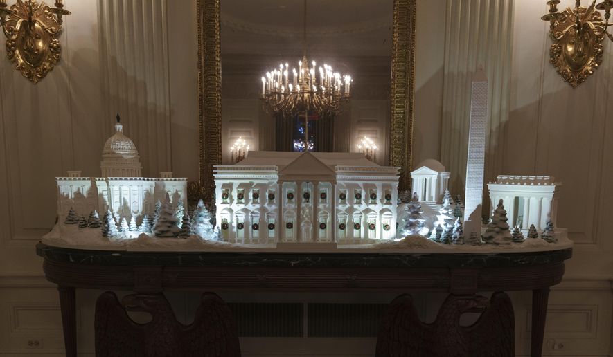 FILE - In this Nov. 26, 2018 file photo, the gingerbread house, showcasing the full expanse of the National Mall: the Capitol, the Lincoln Memorial, the Jefferson Memorial, the Washington Monument, and, the White House is seen in the State Dining Room during the 2018 Christmas Press Preview at the White House in Washington. The theme of this year’s White House holiday decor, revealed by the first lady this week, is “American Treasures,” The Associated Press reported. It is not “Christmas Traditions,” as claimed in a social media post. One element that is significantly different this year is the traditional White House gingerbread house, which is a massive, sugary replica of the entire National Mall. (AP Photo/Carolyn Kaster, File)